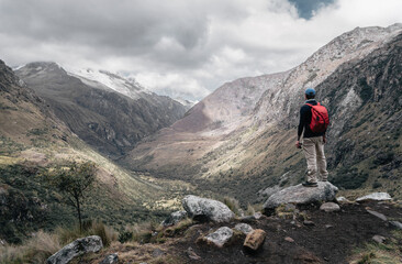 Fototapeta premium Man admires the landscape at Huascaran National Park. Peru