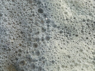 Foam made by the wave on the beach