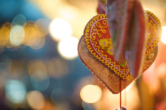 Selective focus of licitar heart hanging on the streets in Pozarevac, Serbia with bokeh background