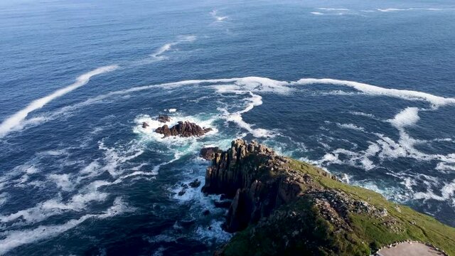 4K Drone footage of Lands End with blue sea in Cornwall, England