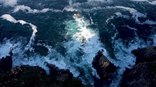 4K Drone footage of waves crashing around Lands End in Cornwall, England