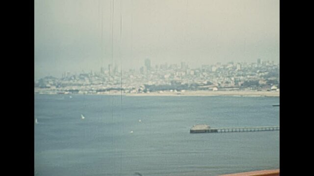 Archival of a point of view of vintage car crossing Golden Gate Bridge toll stop from Presidio Pacific point to the north. 1970s Archival of California, United States of America in 1976.