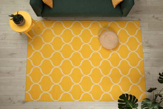 Yellow Carpet With Geometric Pattern On Wooden Floor In Living Room, Above View