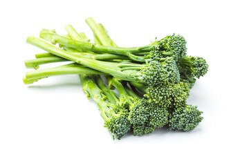 Raw broccolini heap isolated on white background