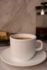 Cup of coffee on a blurred background.