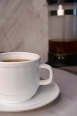 Cup of coffee on a blurred background.