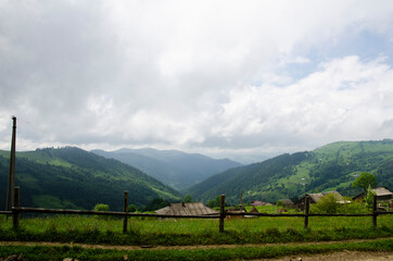 Fototapeta na wymiar Beautiful green landscape. Path to the top. Cloudy day in the Carpathian Mountains.
