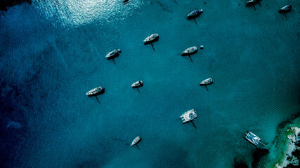 Ariel drone shot of yachts in a circle - Lakka, Corfu, Greece