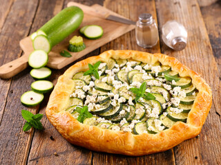 zucchini tart with feta cheese and mint leaf