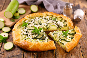 zucchini tart with feta cheese and mint leaf