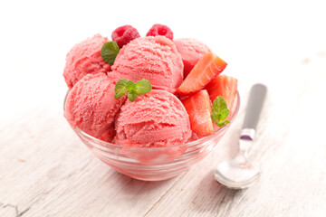 strawberry ice cream scoop in bowl