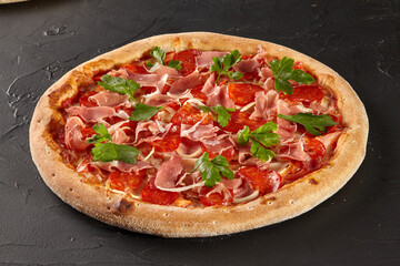 Meat pizza with salami, bacon and prosciutto