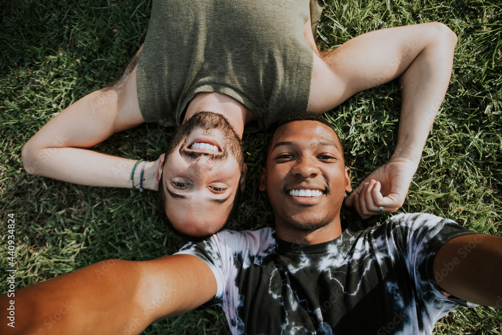 Sticker gay couple relaxing in the grass