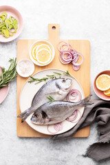 Two raw fish prepared for the cooking, top down view