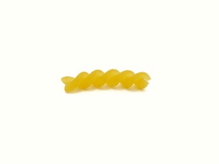 Fusilli pasta on a white background