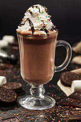 Glass cup of delicious hot chocolate with whipped cream