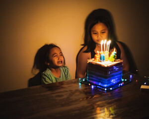 Cute crying little  girl celebrating birthday. Child unhappy for no reason indoor. Photo may...