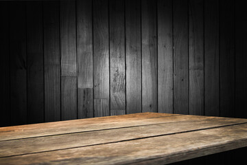 wooden dark background with empty wooden table for montage of your product