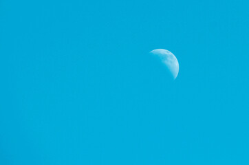 Moon in blue sky, minimalism