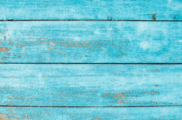 Wall texture with blue cracked paint
