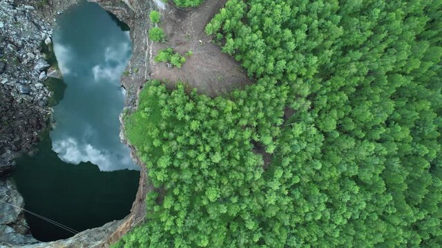 Tuimsky failure. tectonic fault, man-made disaster. Unusual natural phenomena and places. A hollow in the ground, a mountain lake. Russia, Khakassia