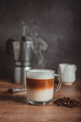 Latte machiato with vintage coffee maker