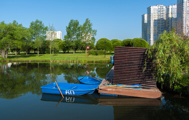 Boat station on the city pond in the city park