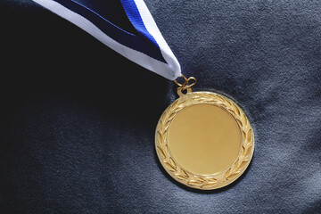 Gold medal on velvet cushion. Olympic games