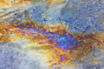 spilled gasoline rainbow background, industrial hazard spill pollution, abstract texture multicolored