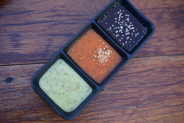 Sauce in  bowl on wood table.