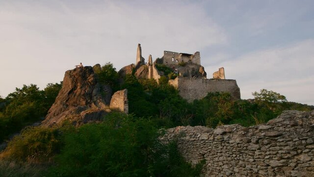Small part of a ruined castle on top of a mountain. Slider shot around of ruined Durnstein castle, Wachau valley, Austria. The ruins of Kuenringer Castle, here King Lionheart was imprissoned