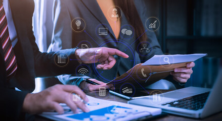 Concept of digital diagram, graph interfaces, virtual screen,connections icon, team doing business meeting working with startup project in modern office.