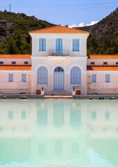 A disused and abandoned hydrotherapy facility with a thermal water pool at the Methana spa resort...