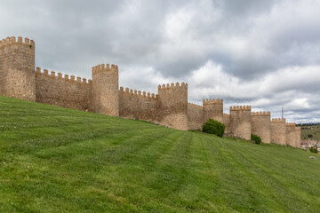 Fototapeta na wymiar Majestic view of Ávila city Walls & fortress, full around view at the medieval historic city