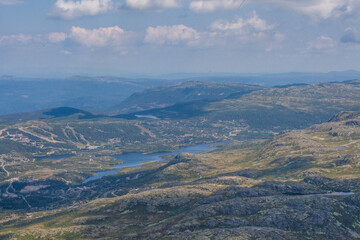 Wide landscape of mountain range with lake