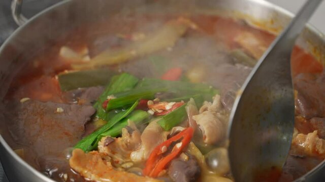 Pig intestine with duck blood. Taiwanese traditional spicy hot pot soup.