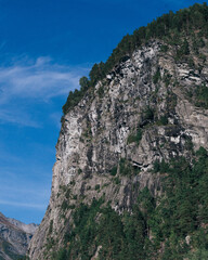 cliff in the mountains with blue sky