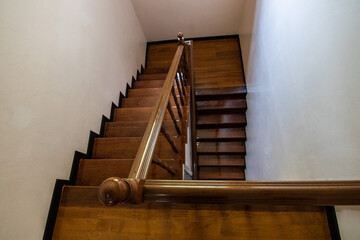 Top view of a wooden staircase showcasing clean lines, natural texture, and architectural design....