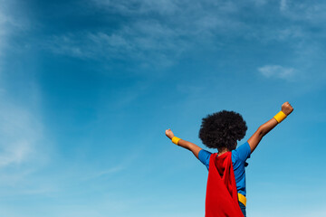 Girl with afro playing superhero