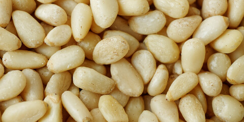 Pine nuts background. Abstract texture food close-up.