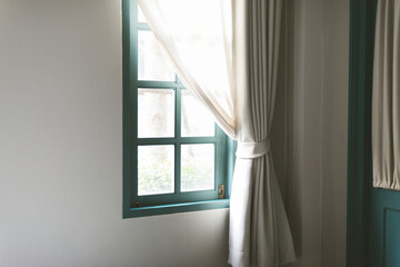 Fototapeta na wymiar Simple window with white curtain