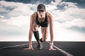Image of a girl standing on the start line of the track. Running concept.