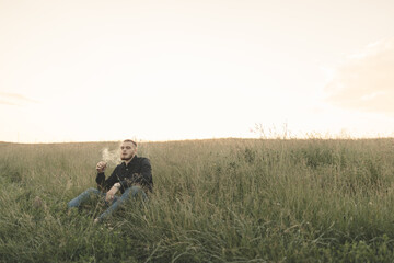 man in the field smoking cigar