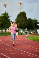 Fototapeta premium Woman running on track
