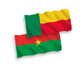 National vector fabric wave flags of Burkina Faso and Benin isolated on white background. 1 to 2 proportion.