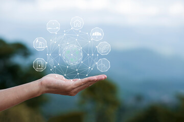 Technology, hand holding with environment Icons over the Network connection on green background.