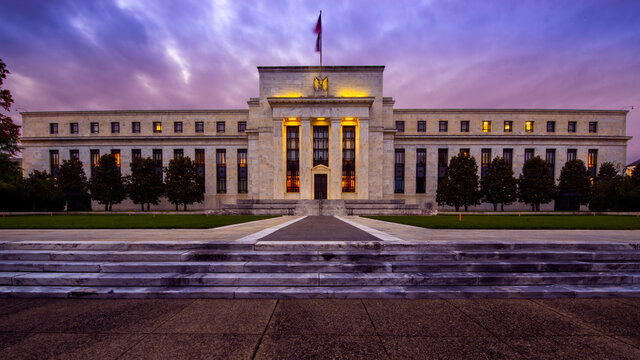 Front of the United States Federal Reserve Bank, the government agency that controls interest rates, at sunset in Washington DC in the Summer.