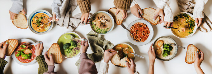 People eating various Autumn and Winter creamy vegan soups together