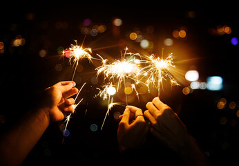 Celebrating with sparklers in the night