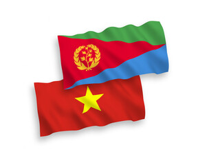 National vector fabric wave flags of Eritrea and Vietnam isolated on white background. 1 to 2 proportion.